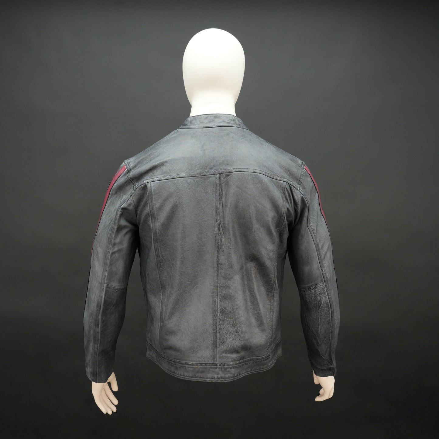 Black jacket 6010 with front zip closure, snap-button collar, multiple pockets, and red arm stripes, combining style and practicality for everyday wear
