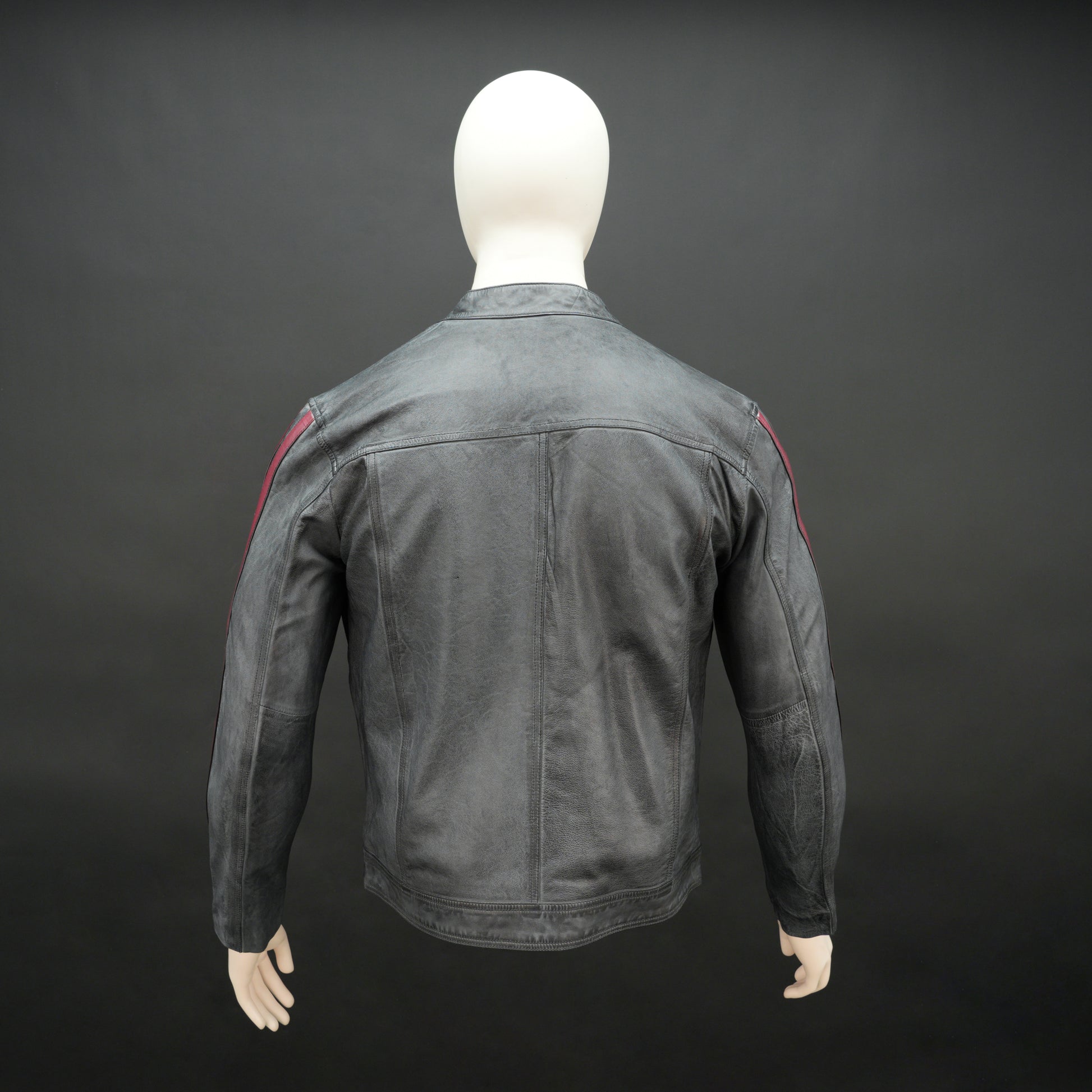 Black jacket 6010 with front zip closure, snap-button collar, multiple pockets, and red arm stripes, combining style and practicality for everyday wear