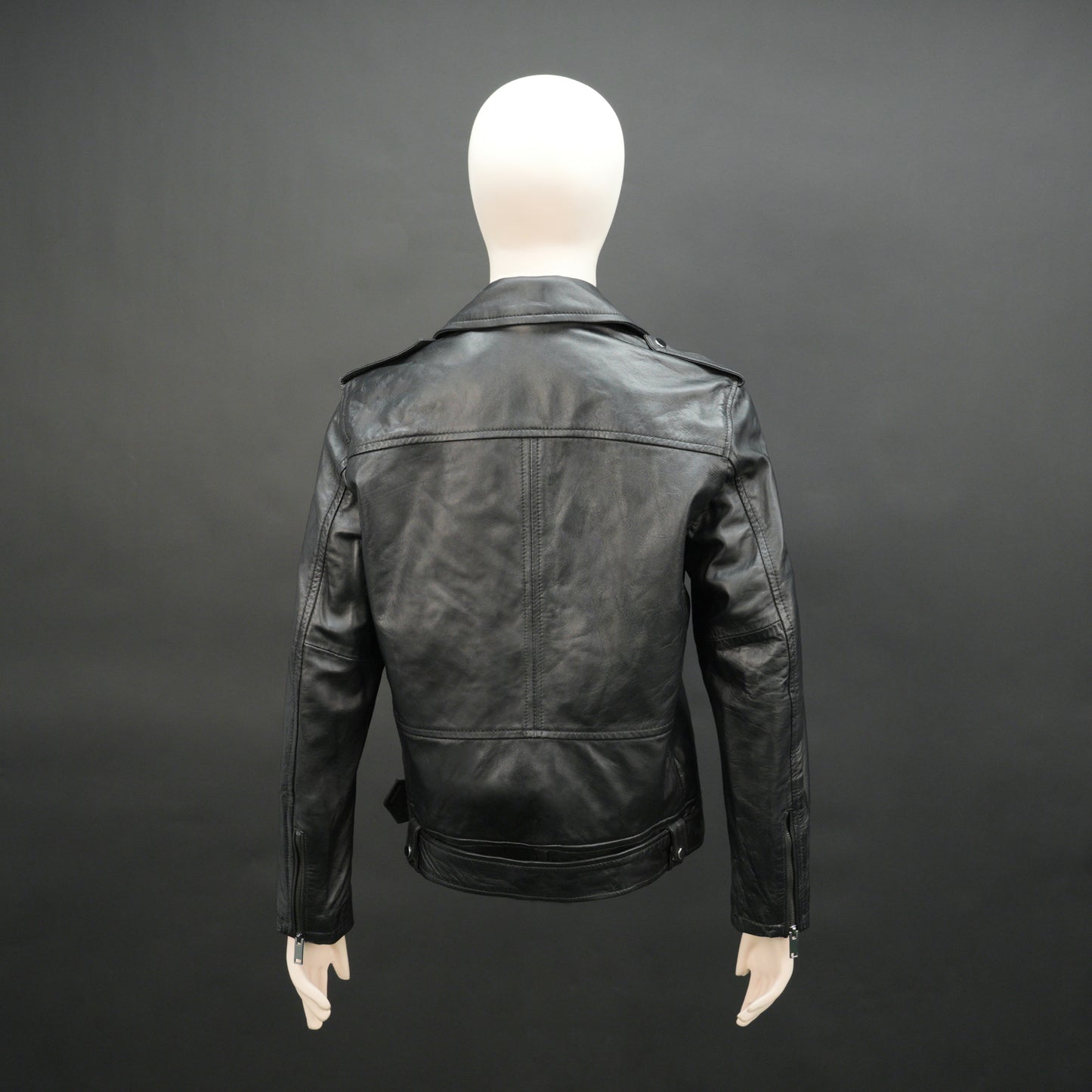 Black sheep leather jacket with adjustable waist belt, two front side pockets, one inside pocket, and zip flap closure