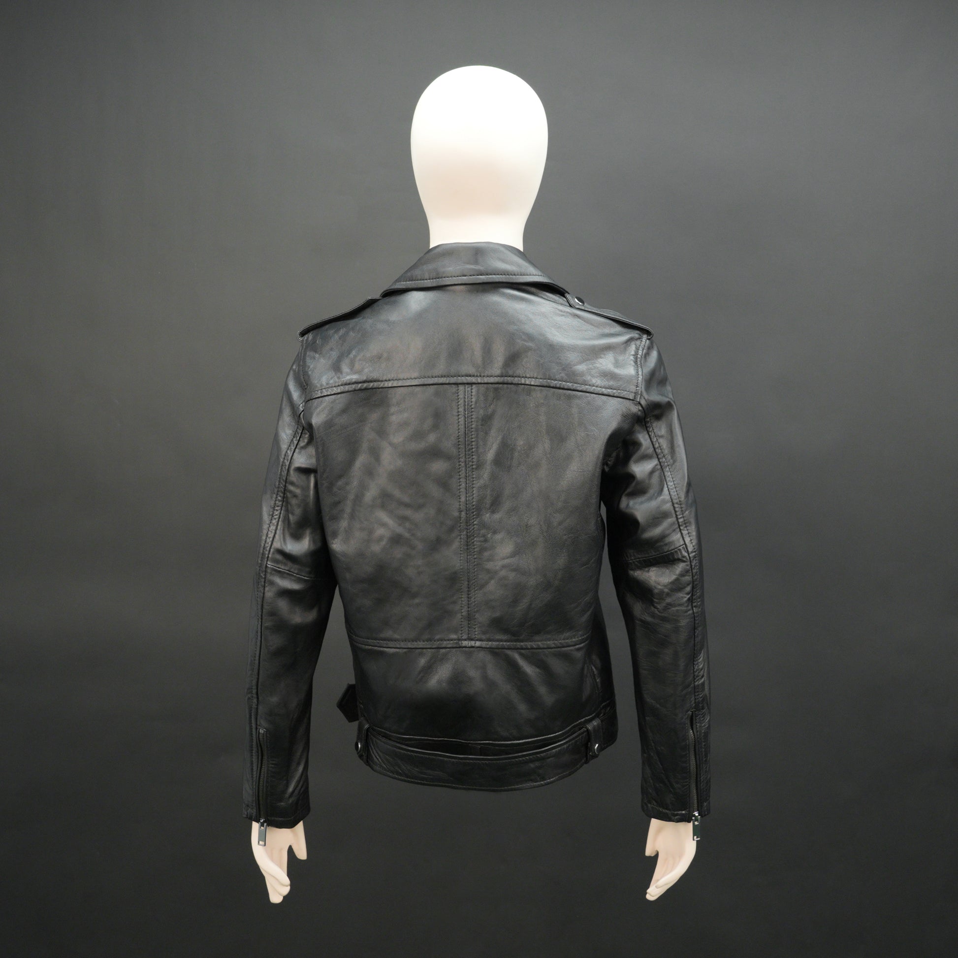 Black sheep leather jacket with adjustable waist belt, two front side pockets, one inside pocket, and zip flap closure