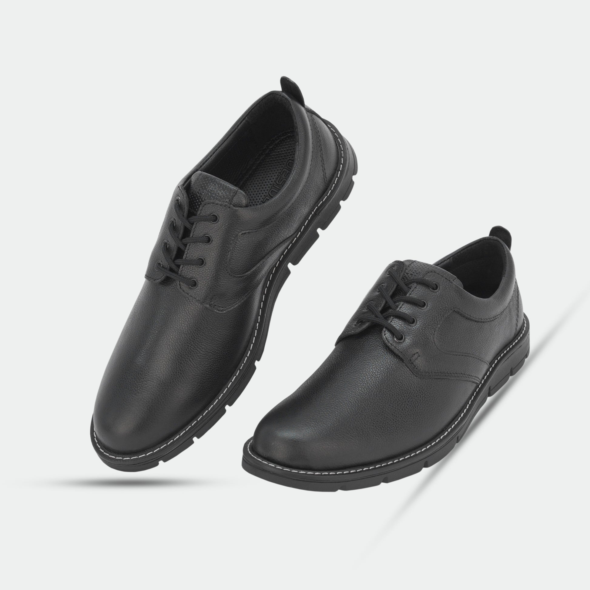 Black footwear featuring genuine cow leather milled commute upper, soft sheep lining, Taxon insole for stability, and lightweight EVA sole for comfort and grip
