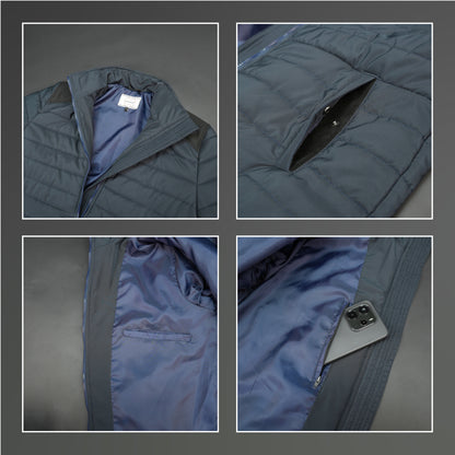 Navy full-sleeve two-tone puffer jacket with snap pockets, quilted insulation, inner compartments, and zip closure