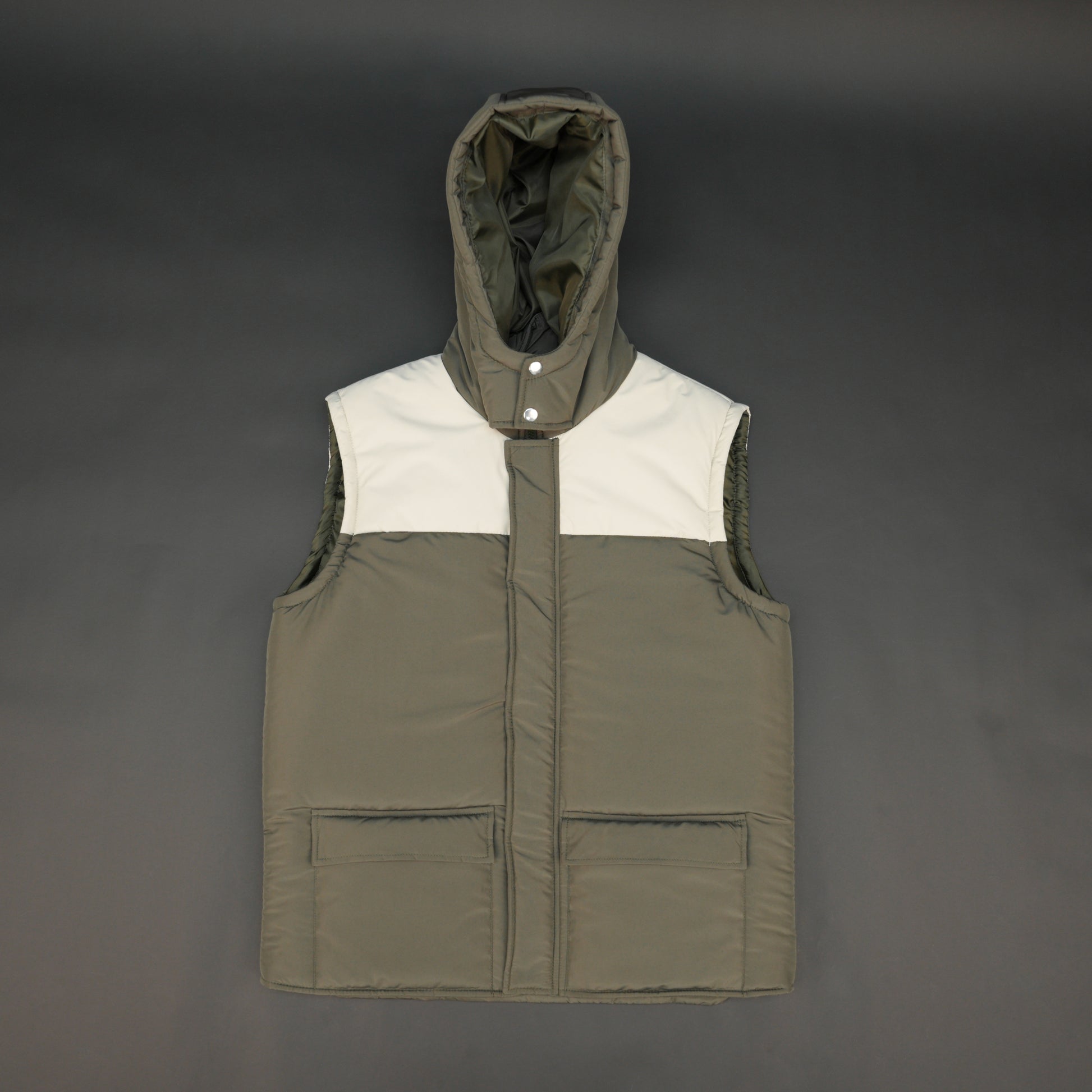Green-cream sleeveless puffer jacket with zip and snap closure, hood, side and inner pockets, quilted for transitional seasons.