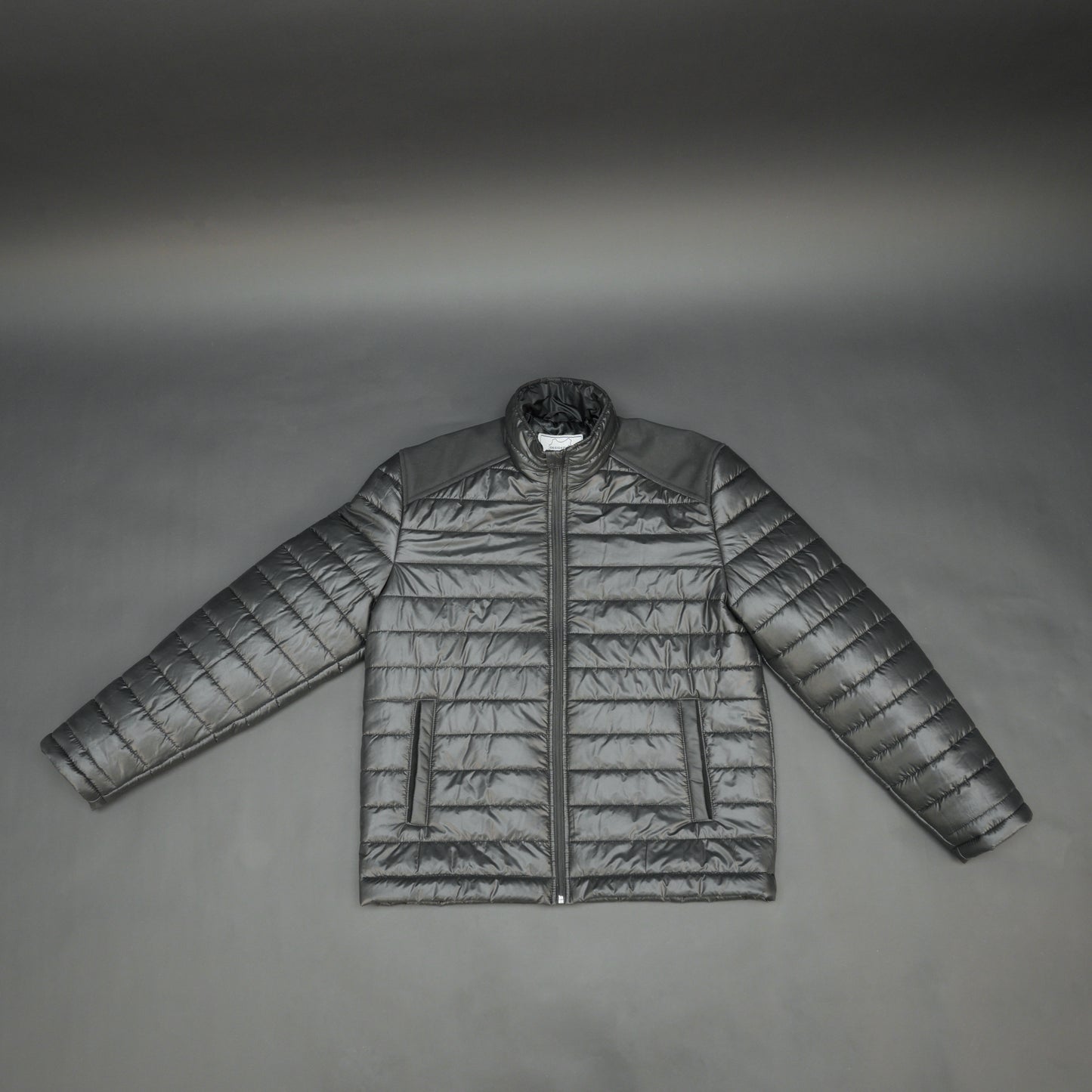 Black full-sleeve two-tone puffer jacket with snap pockets, quilted insulation, inner compartments, and zip closure