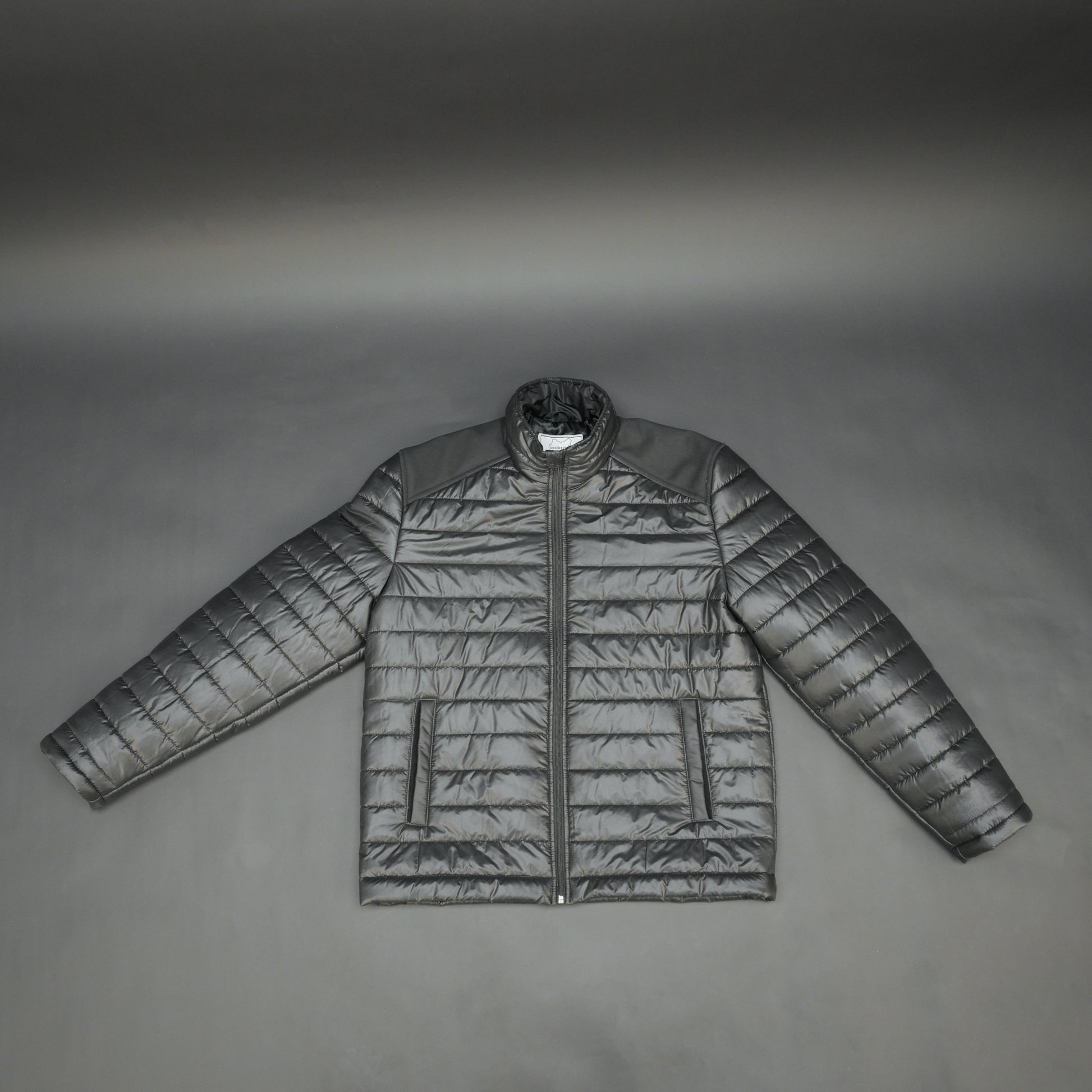 Black full-sleeve two-tone puffer jacket with snap pockets, quilted insulation, inner compartments, and zip closure