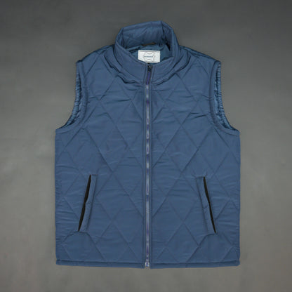 Blue sleeveless puffer vest with zip, side and inside pockets, lightweight for layering
