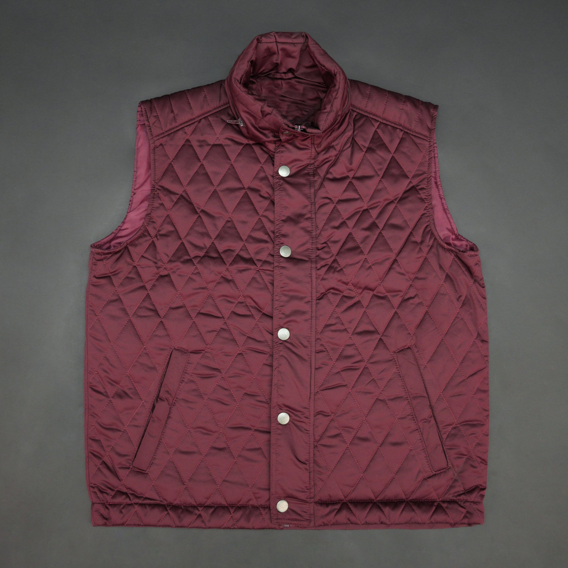 Maroon vest featuring a zip closure with snap button, two snap-button side pockets, and an inside pocket for secure, convenient storage