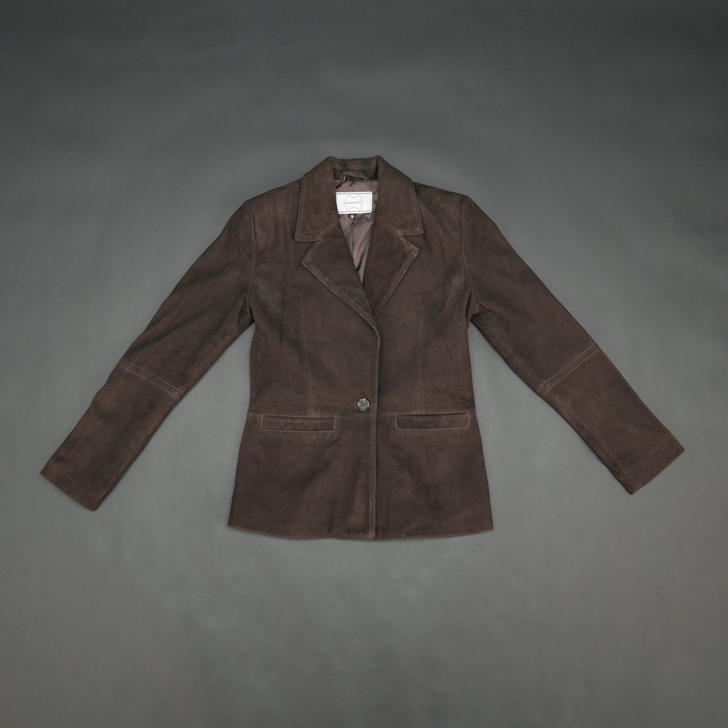 Dark brown goat leather coat with soft, durable material, two functional pockets, and versatile design for casual and formal wear