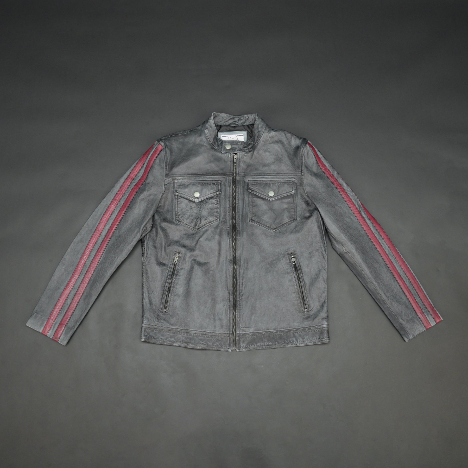 Black jacket 6010 with front zip closure, snap-button collar, multiple pockets, and red arm stripes, combining style and practicality for everyday wear