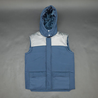 Blue-grey sleeveless two-tone puffer jacket with zip, snap buttons, hood, side and inner pockets, insulated for layering