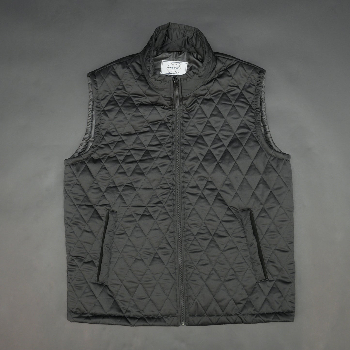 Lightweight black quilted sleeveless  puffer vest with zip closure, side and inside pockets, ideal for layering