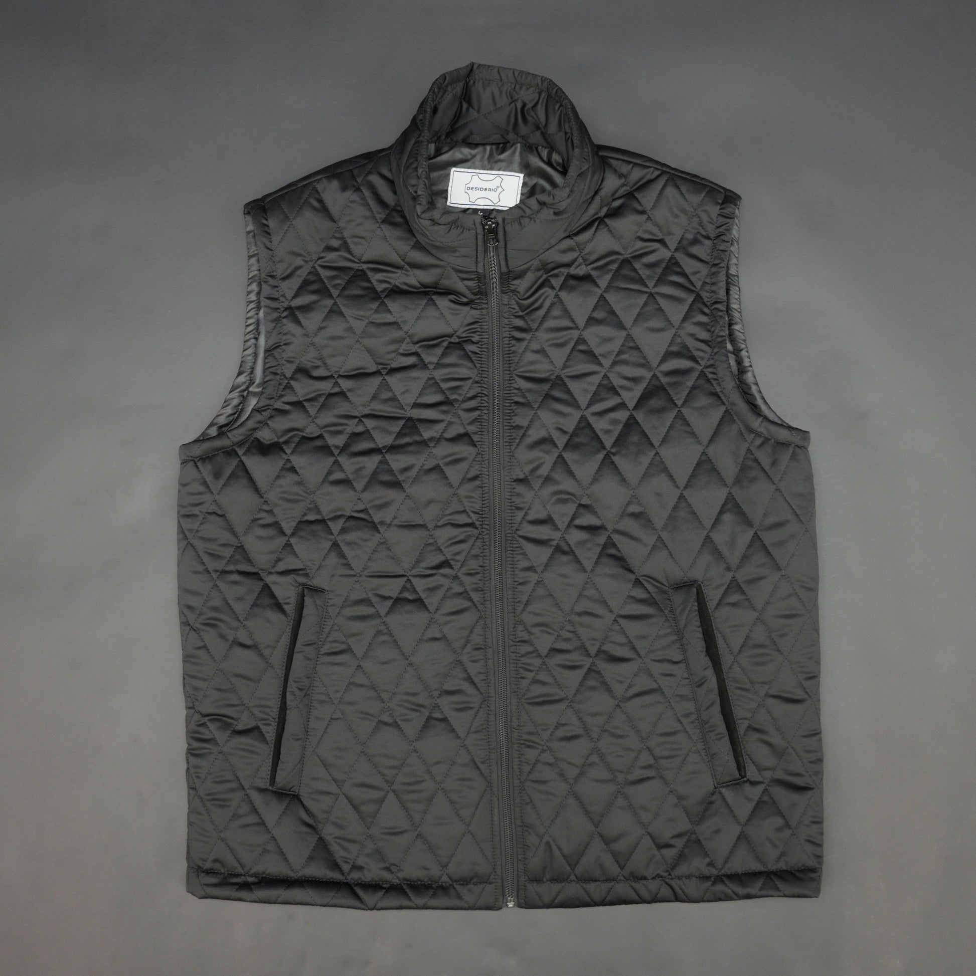 Lightweight black quilted sleeveless  puffer vest with zip closure, side and inside pockets, ideal for layering