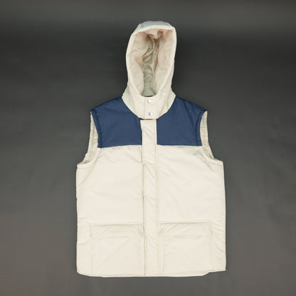 Cream-blue two-tone sleeveless puffer jacket with zip and snap closure, hood, side and inner pockets, quilted for layering