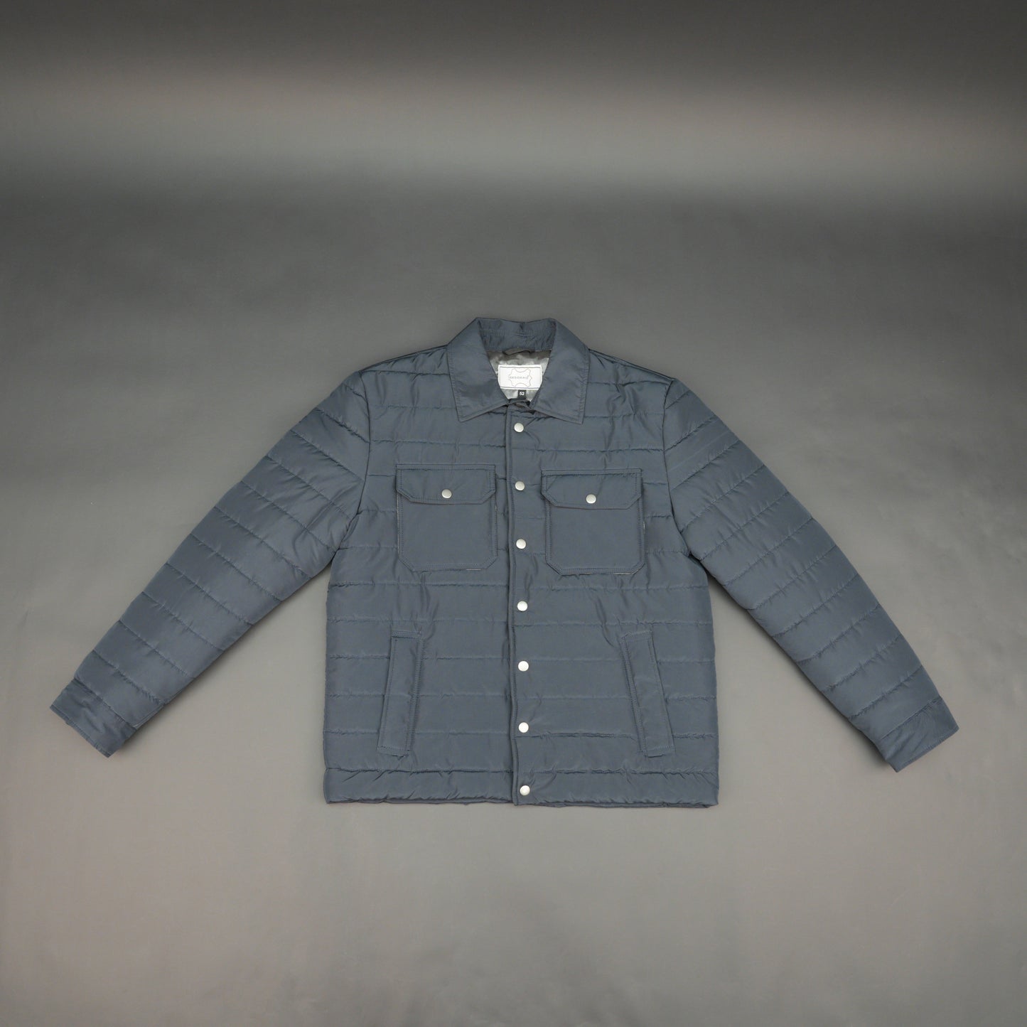 Navy full-sleeve puffer jacket with snap closure, quilted design, inner and outer pockets, crafted for everyday warmth