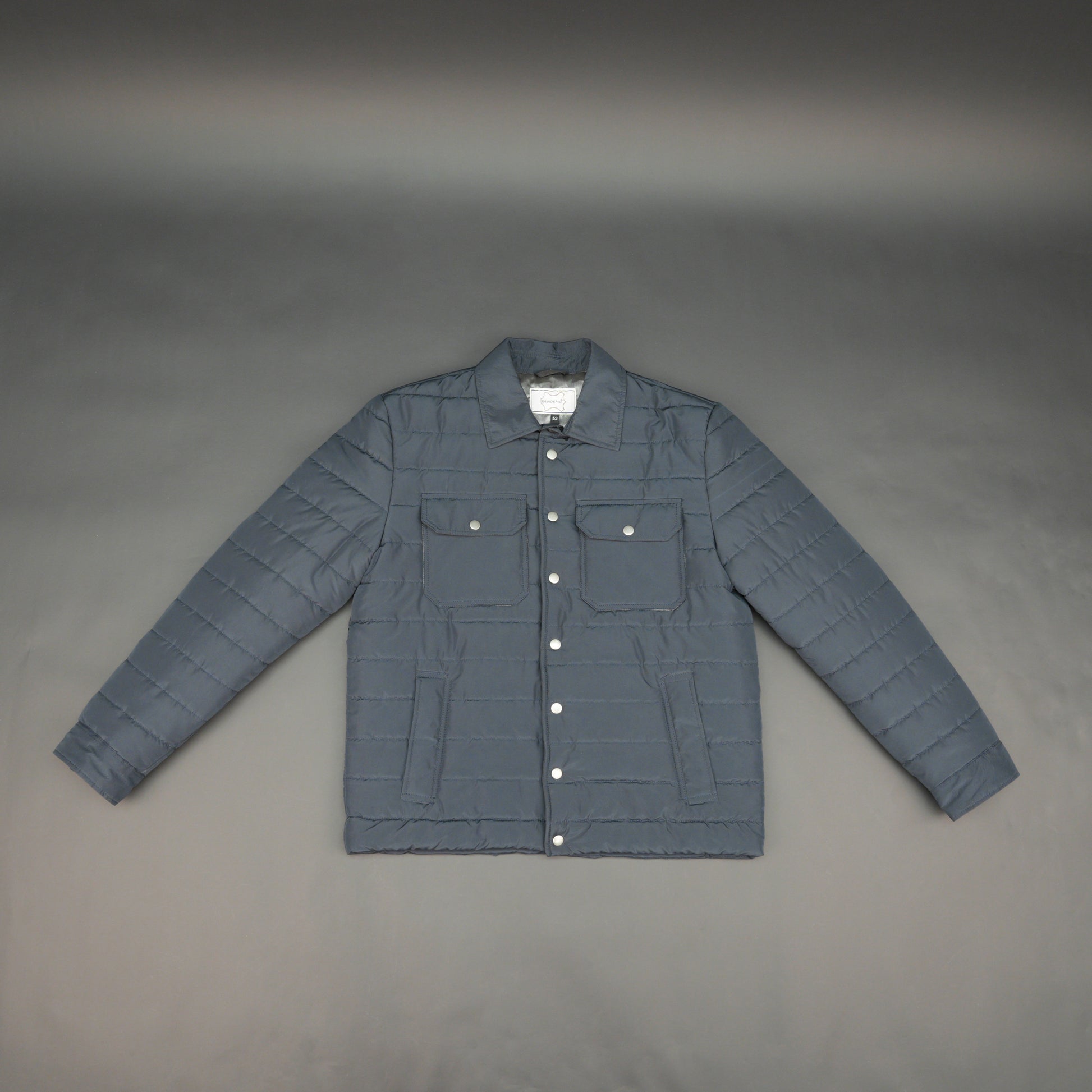 Navy full-sleeve puffer jacket with snap closure, quilted design, inner and outer pockets, crafted for everyday warmth