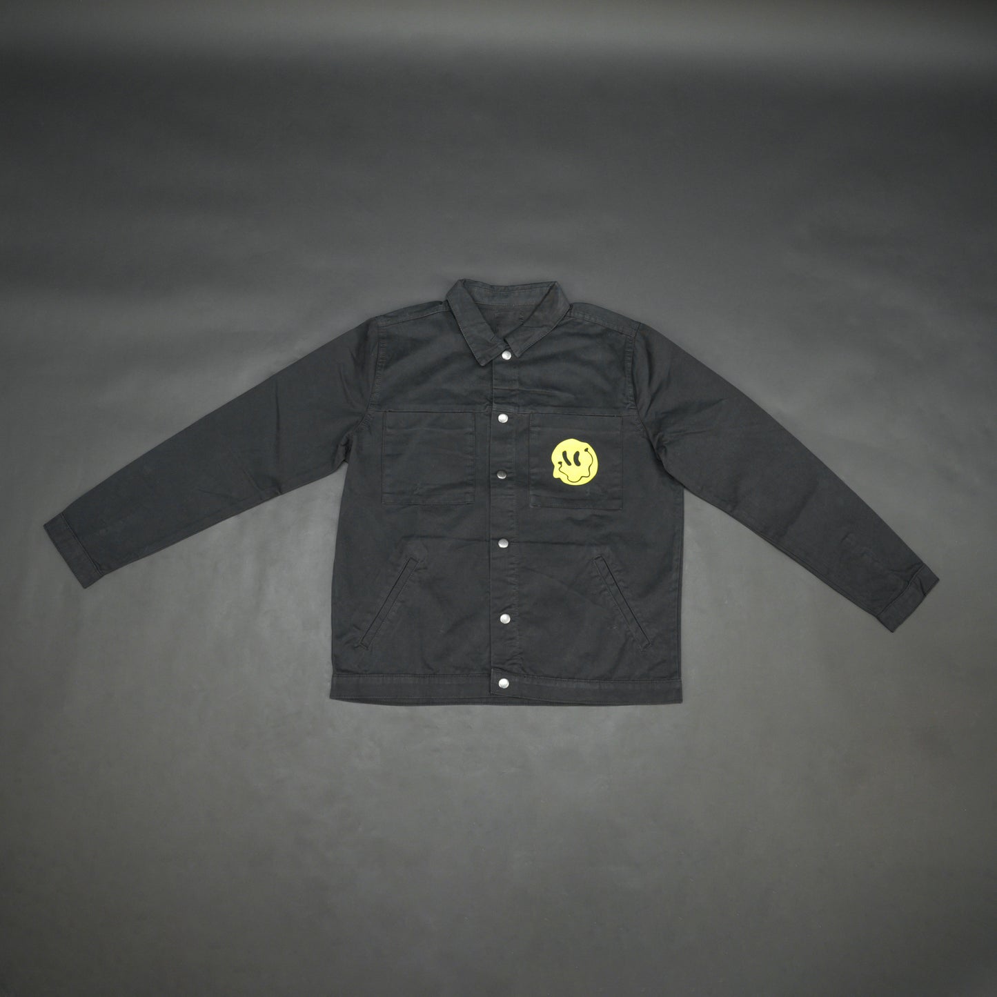 Black denim jacket featuring ‘Stay Blessed’ graphic on the back, button-down front, adjustable cuffs, and side pockets perfect for casual wear
