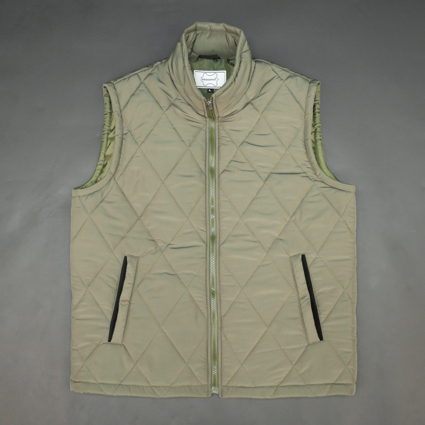 Green sleeveless puffer vest with zip, side and inside pockets, lightweight for layering