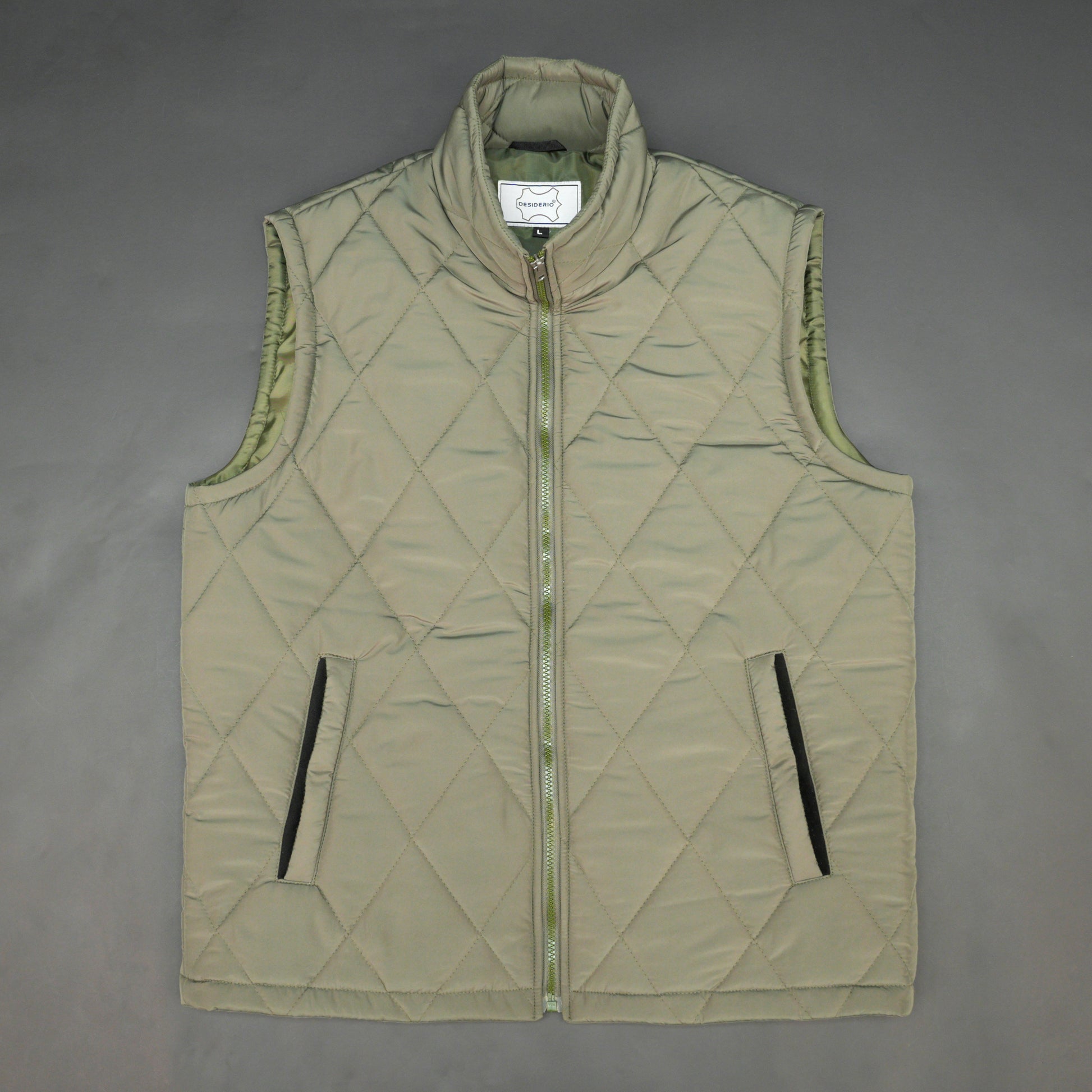 Green sleeveless puffer vest with zip, side and inside pockets, lightweight for layering