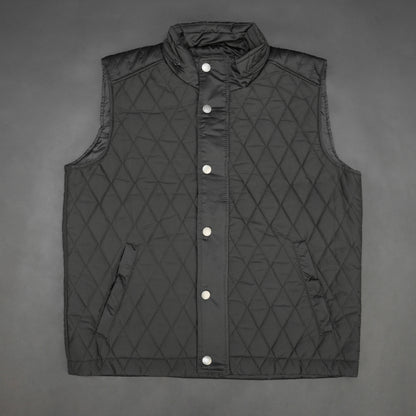 Black vest with a zip closure and snap button, two side pockets with snap buttons, and one inside pocket for secure storage
