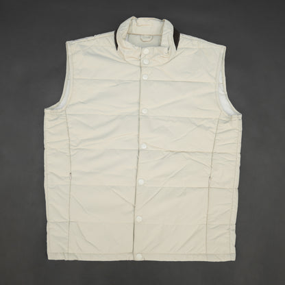 Beige jacket featuring a button closure, two snap-button side pockets, and one inner pocket for convenient, secure storage