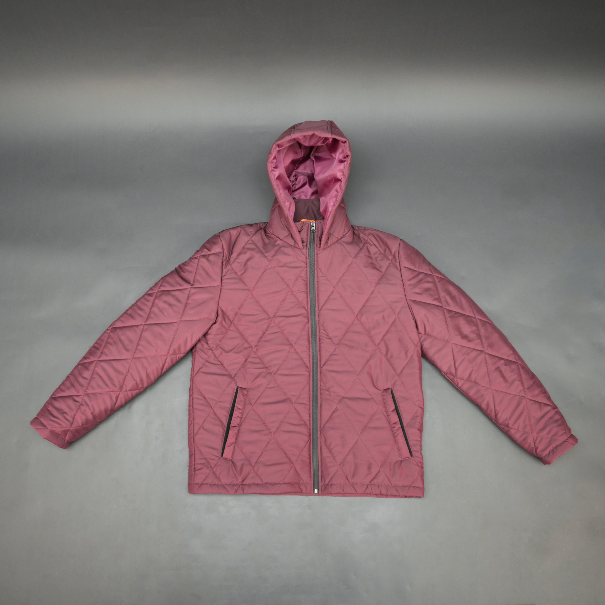 Maroon full-sleeve puffer jacket with zip and hood, side and inner pockets, suitable for cold and windy weather