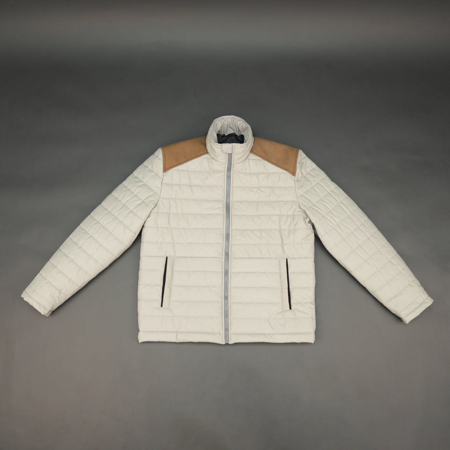 Blue sleeveless puffer vest with zip, side and inside pockets, lightweight for layering