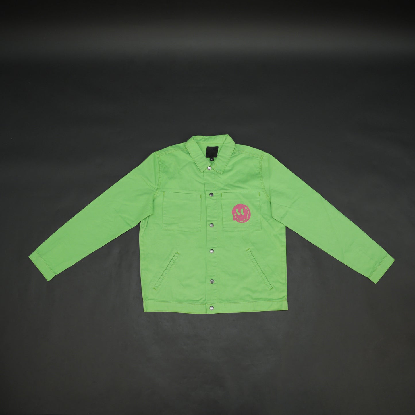 Green denim jacket with bold ‘Stay Blessed’ graphic on the back, button-down front, adjustable cuffs, and side pockets for casual wear