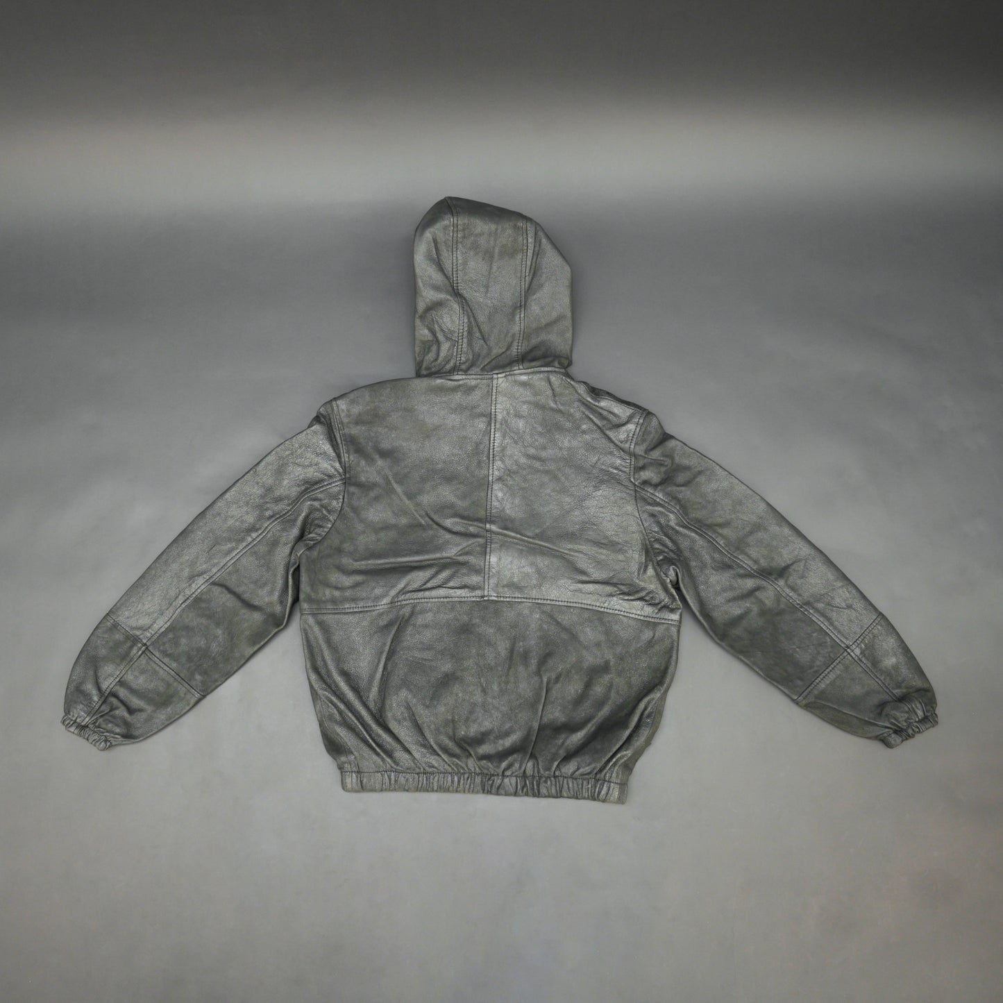 Black hoodie-style jacket made from genuine sheep leather (veg ranger), featuring a front zip closure, adjustable hood, two side pockets, and one inside pocket