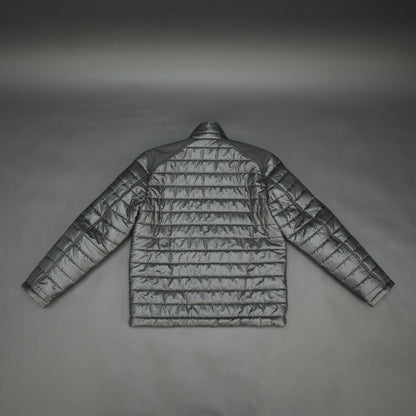 Black full-sleeve two-tone puffer jacket with snap pockets, quilted insulation, inner compartments, and zip closure