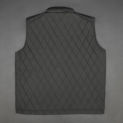 Black vest with a zip closure and snap button, two side pockets with snap buttons, and one inside pocket for secure storage
