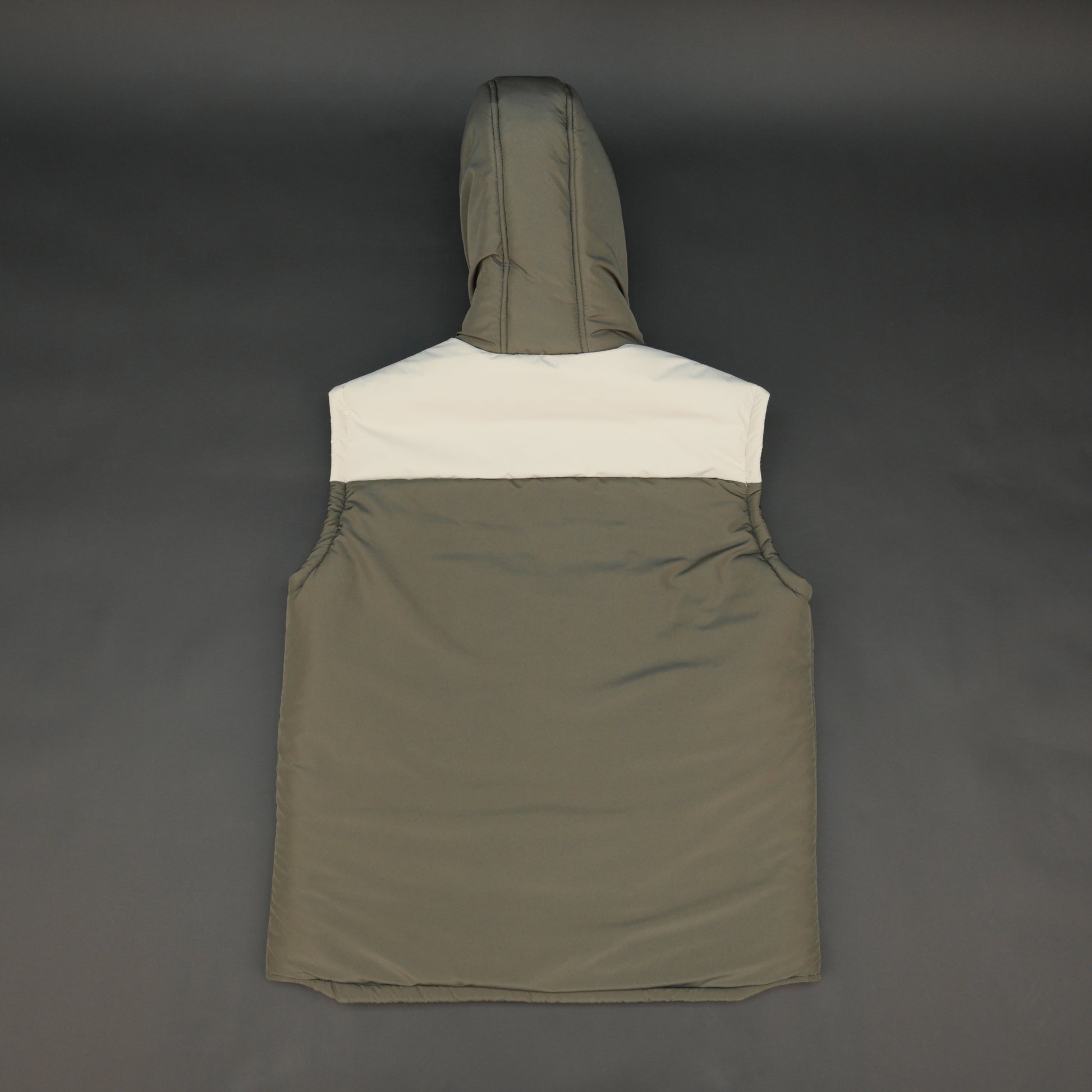 Green-cream sleeveless puffer jacket with zip and snap closure, hood, side and inner pockets, quilted for transitional seasons.