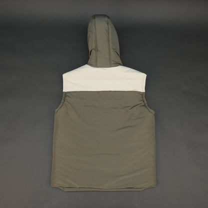 Green-cream sleeveless puffer jacket with zip and snap closure, hood, side and inner pockets, quilted for transitional seasons.