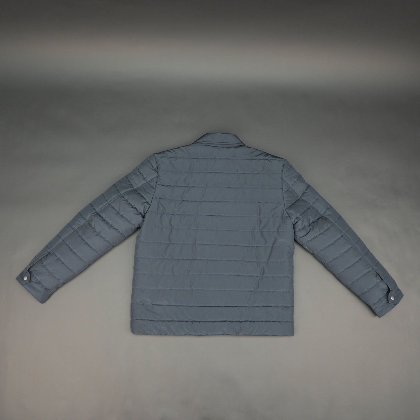 Navy full-sleeve puffer jacket with snap closure, quilted design, inner and outer pockets, crafted for everyday warmth