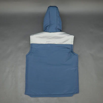 Blue-grey sleeveless two-tone puffer jacket with zip, snap buttons, hood, side and inner pockets, insulated for layering