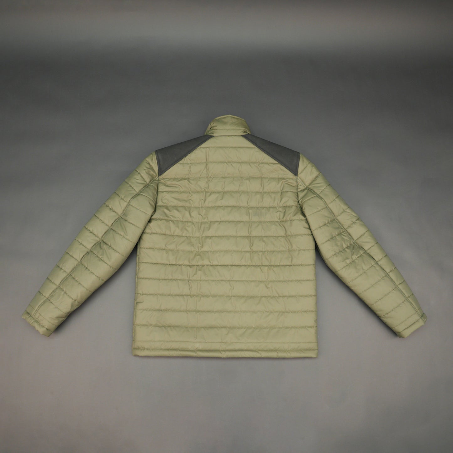 Green full-sleeve two-tone puffer jacket with snap pockets, quilted insulation, inner compartments, and zip closure