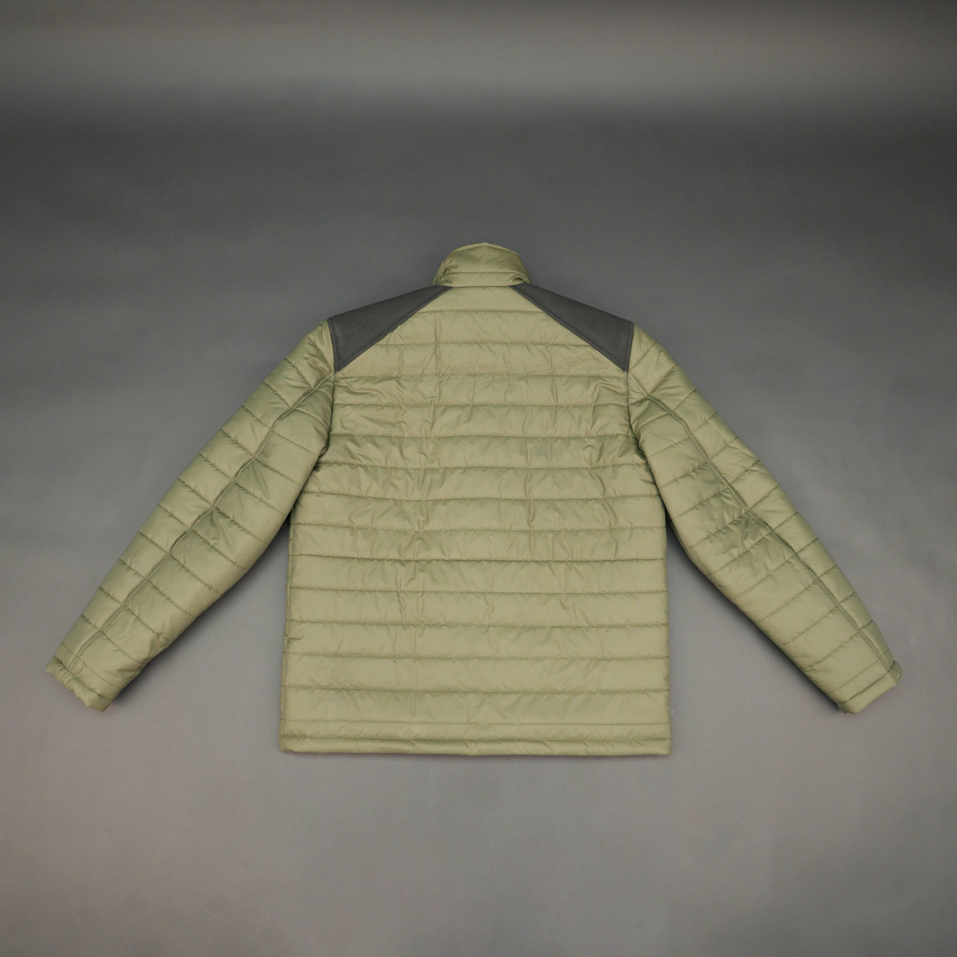 Green full-sleeve two-tone puffer jacket with snap pockets, quilted insulation, inner compartments, and zip closure