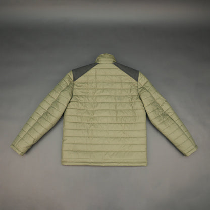 Green full-sleeve two-tone puffer jacket with snap pockets, quilted insulation, inner compartments, and zip closure