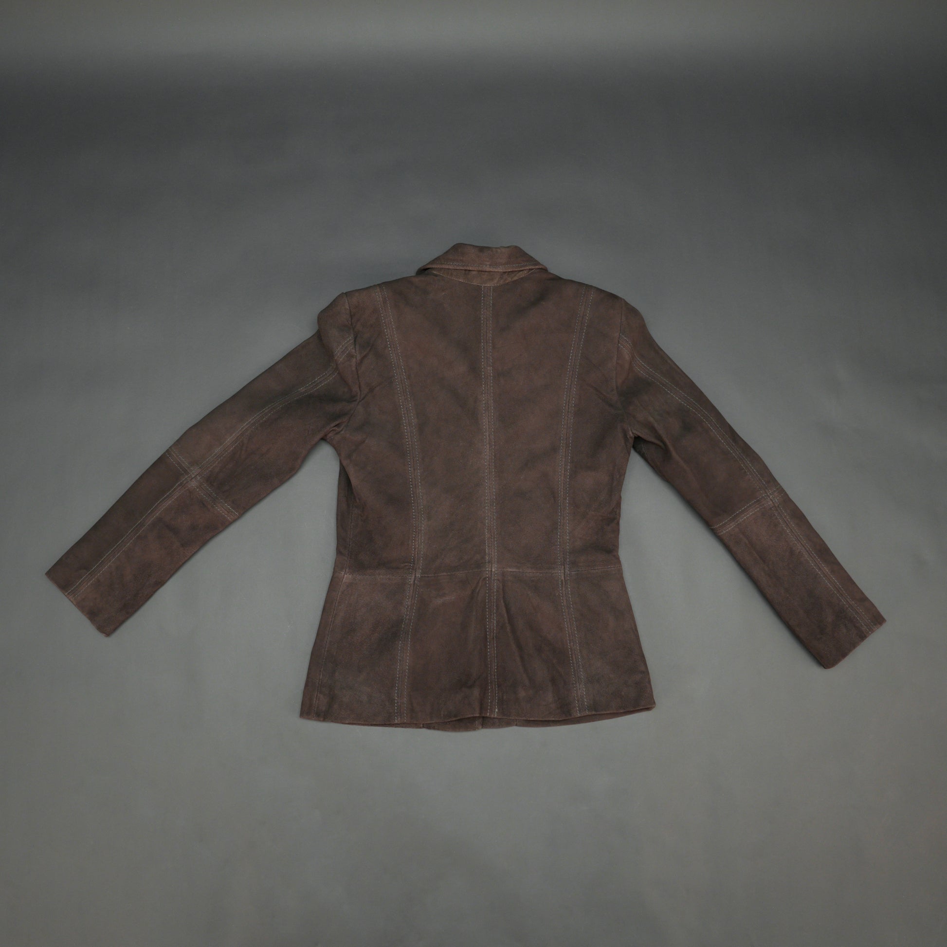 Dark brown goat leather coat with soft, durable material, two functional pockets, and versatile design for casual and formal wear