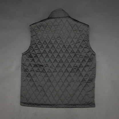 Lightweight black quilted sleeveless  puffer vest with zip closure, side and inside pockets, ideal for layering