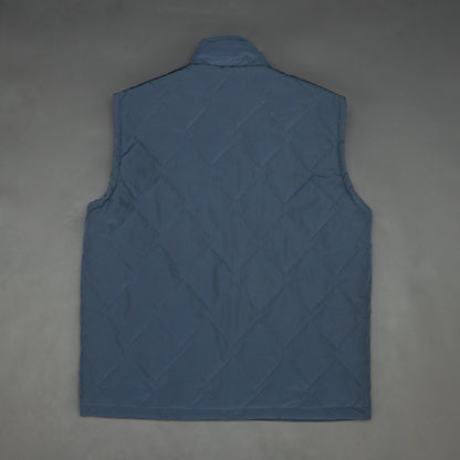 Lightweight navy sleeveless puffer vest with zip closure, side and inside pockets, for layering