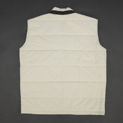 Beige jacket featuring a button closure, two snap-button side pockets, and one inner pocket for convenient, secure storage