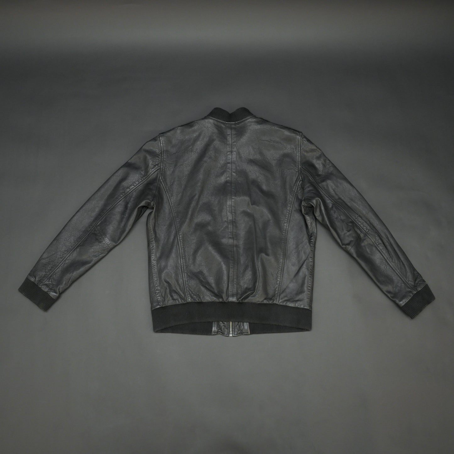 Black sheep leather jacket with soft material, front and inside pockets, and zip closure