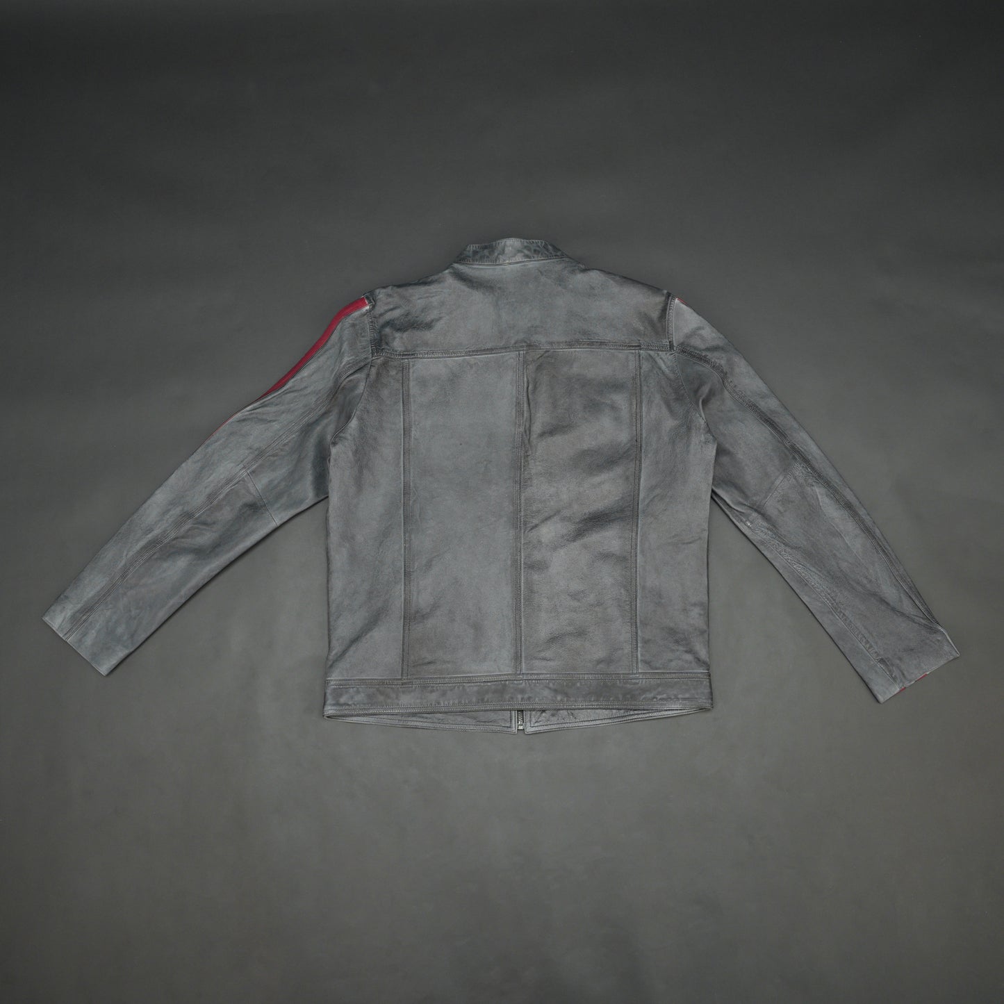 Black jacket 6010 with front zip closure, snap-button collar, multiple pockets, and red arm stripes, combining style and practicality for everyday wear