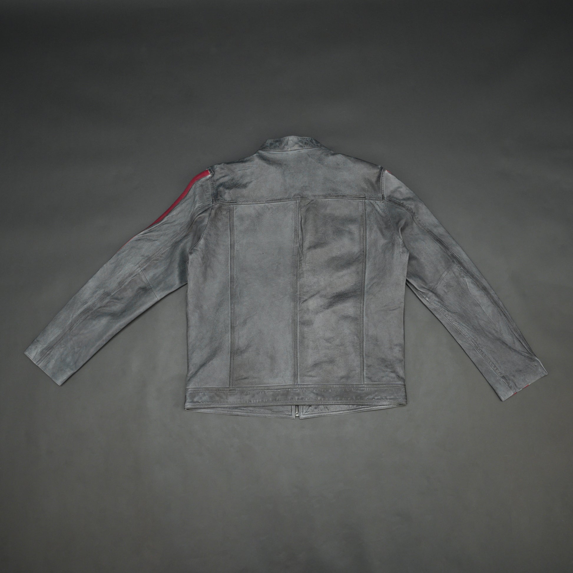 Black jacket 6010 with front zip closure, snap-button collar, multiple pockets, and red arm stripes, combining style and practicality for everyday wear