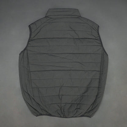 Black garment featuring a front zip closure, two snap-button side pockets, and two inside pockets for secure, convenient storage