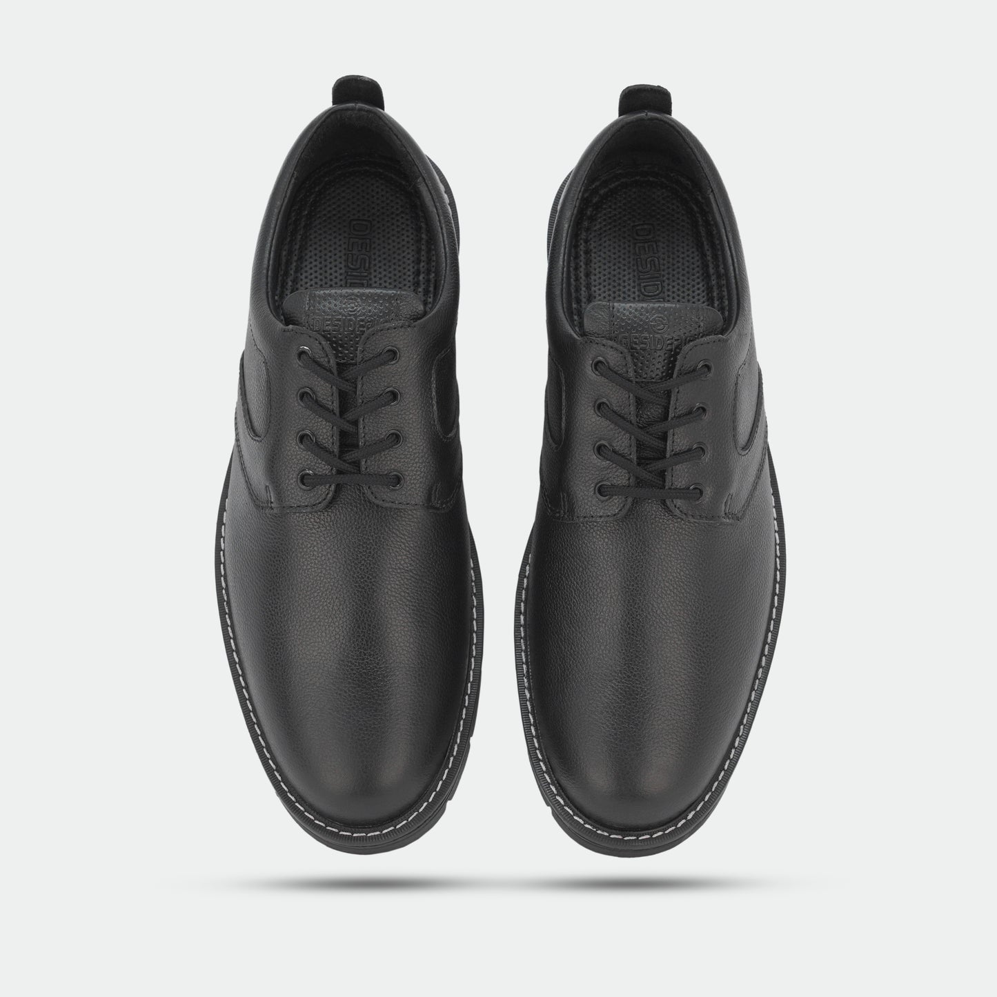 Black footwear featuring genuine cow leather milled commute upper, soft sheep lining, Taxon insole for stability, and lightweight EVA sole for comfort and grip