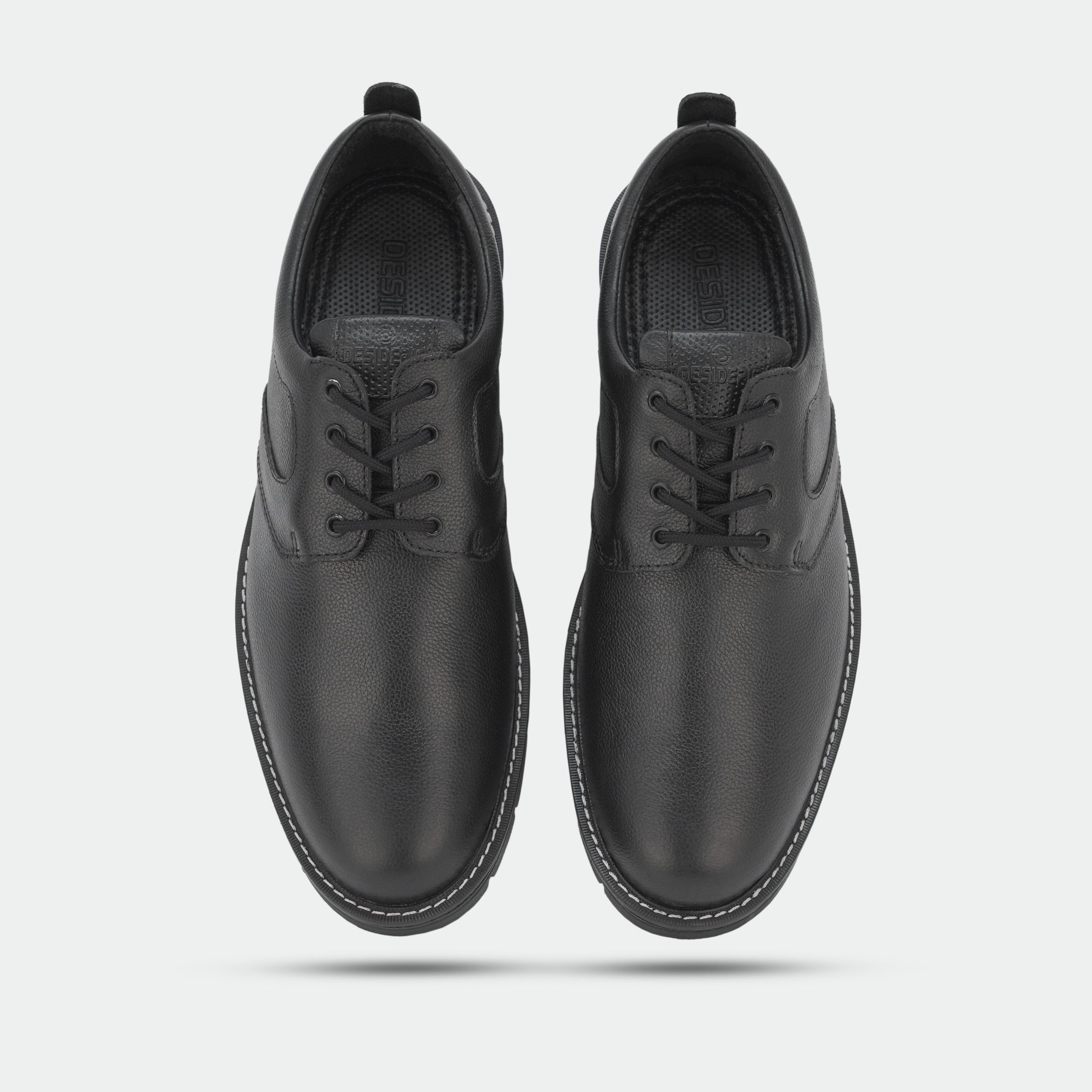 Black footwear featuring genuine cow leather milled commute upper, soft sheep lining, Taxon insole for stability, and lightweight EVA sole for comfort and grip