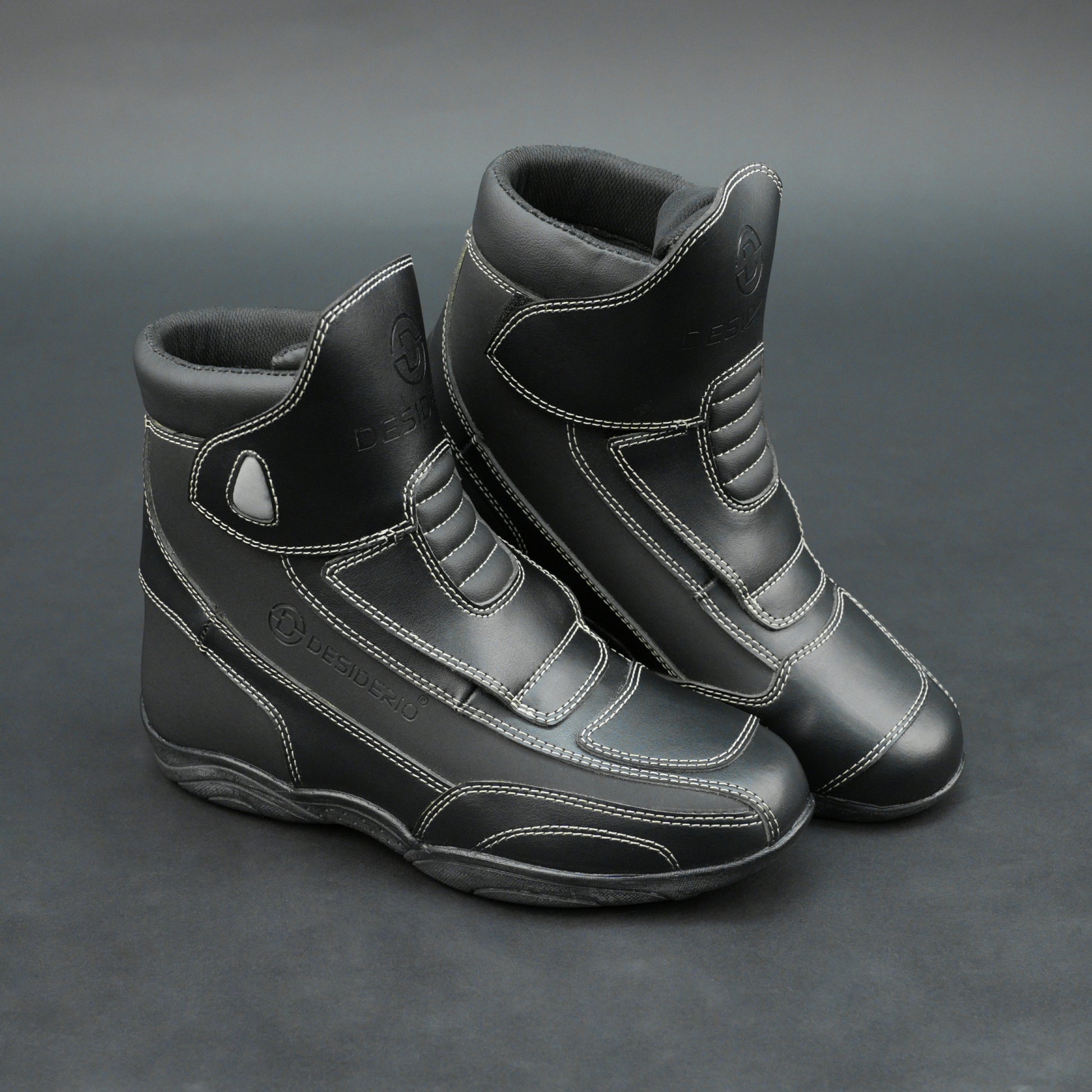 Premium black bovine leather biker boots with white stitching and Velcro straps.