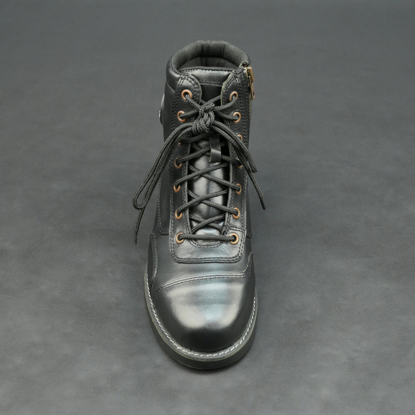 Black high-ankle bovine leather motorbike boots.