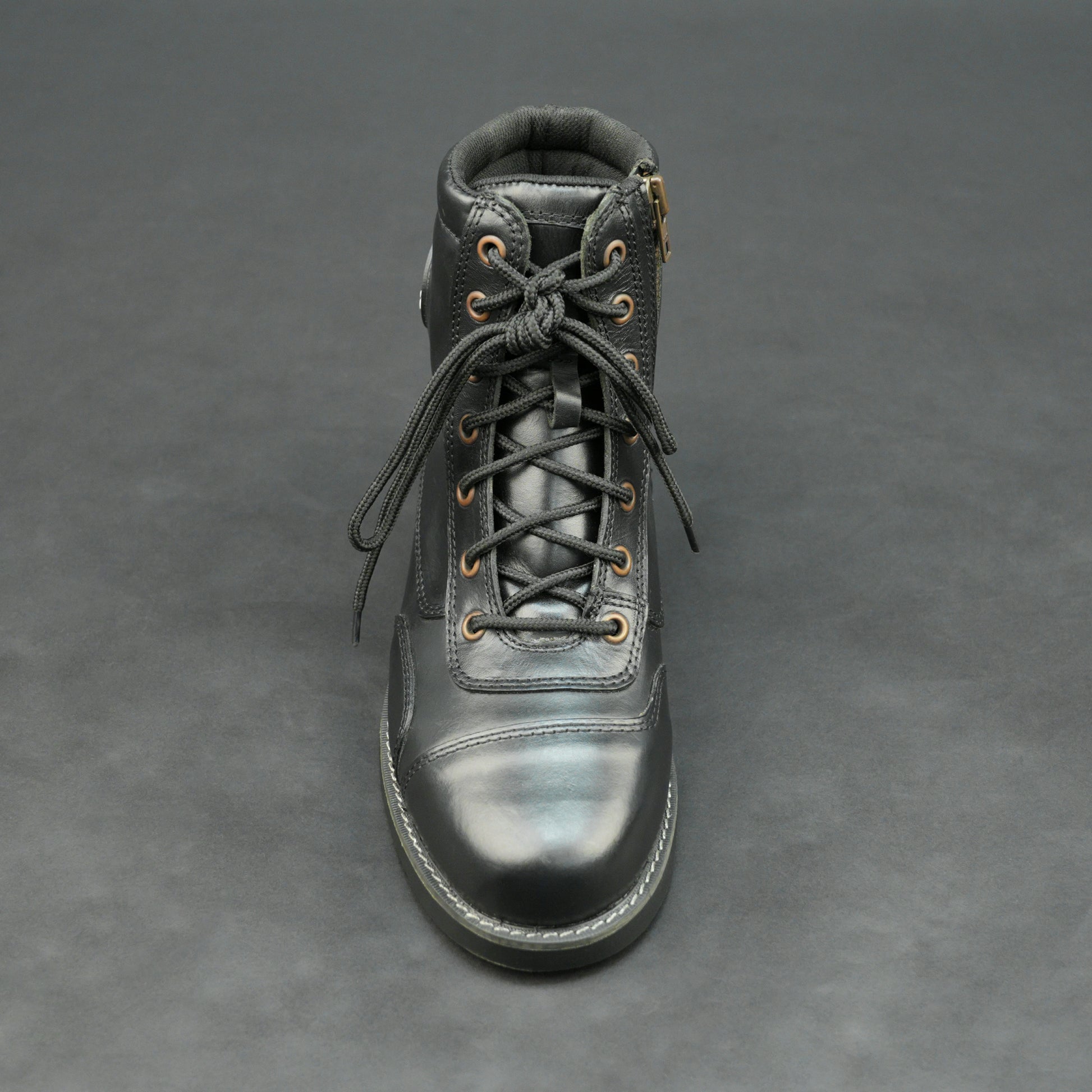Black high-ankle bovine leather motorbike boots.